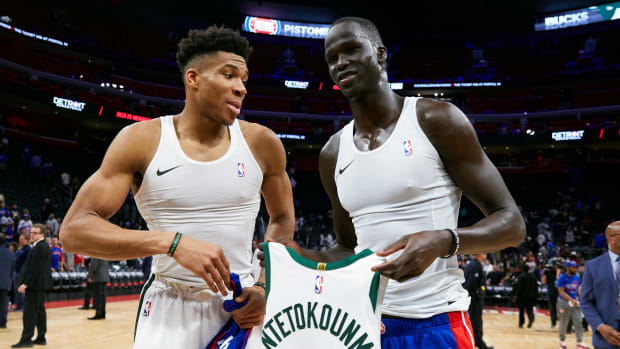 Apr 22, 2019; Detroit, MI, USA; Milwaukee Bucks forward Giannis Antetokounmpo (34) and Detroit Pistons forward Thon Maker (7) exchange jerseys after the game at Little Caesars Arena.